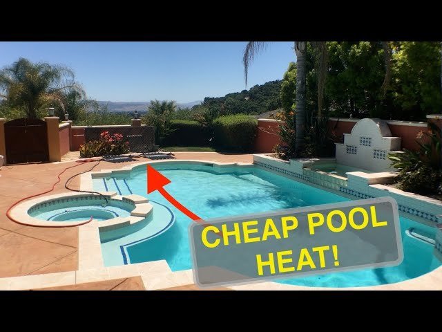 A thermal solar cover floating on a backyard pool to provide the best cheap way to heat a pool.