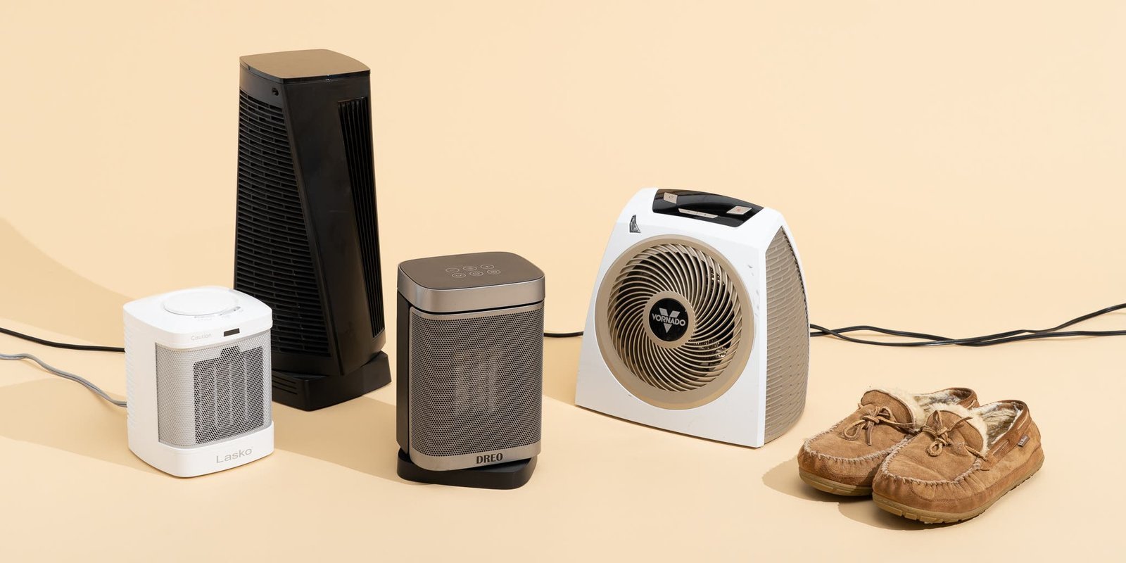 A modern space heater sits on a hardwood floor in a cozy living room.